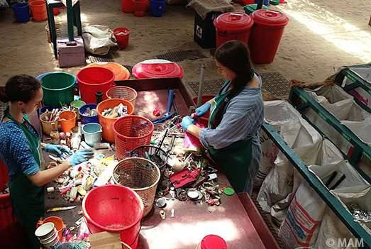 Volunteers sorting waste at the Amritapuri recycling centre