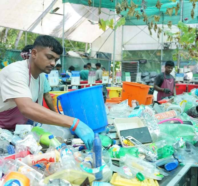 Worker sorting plastics